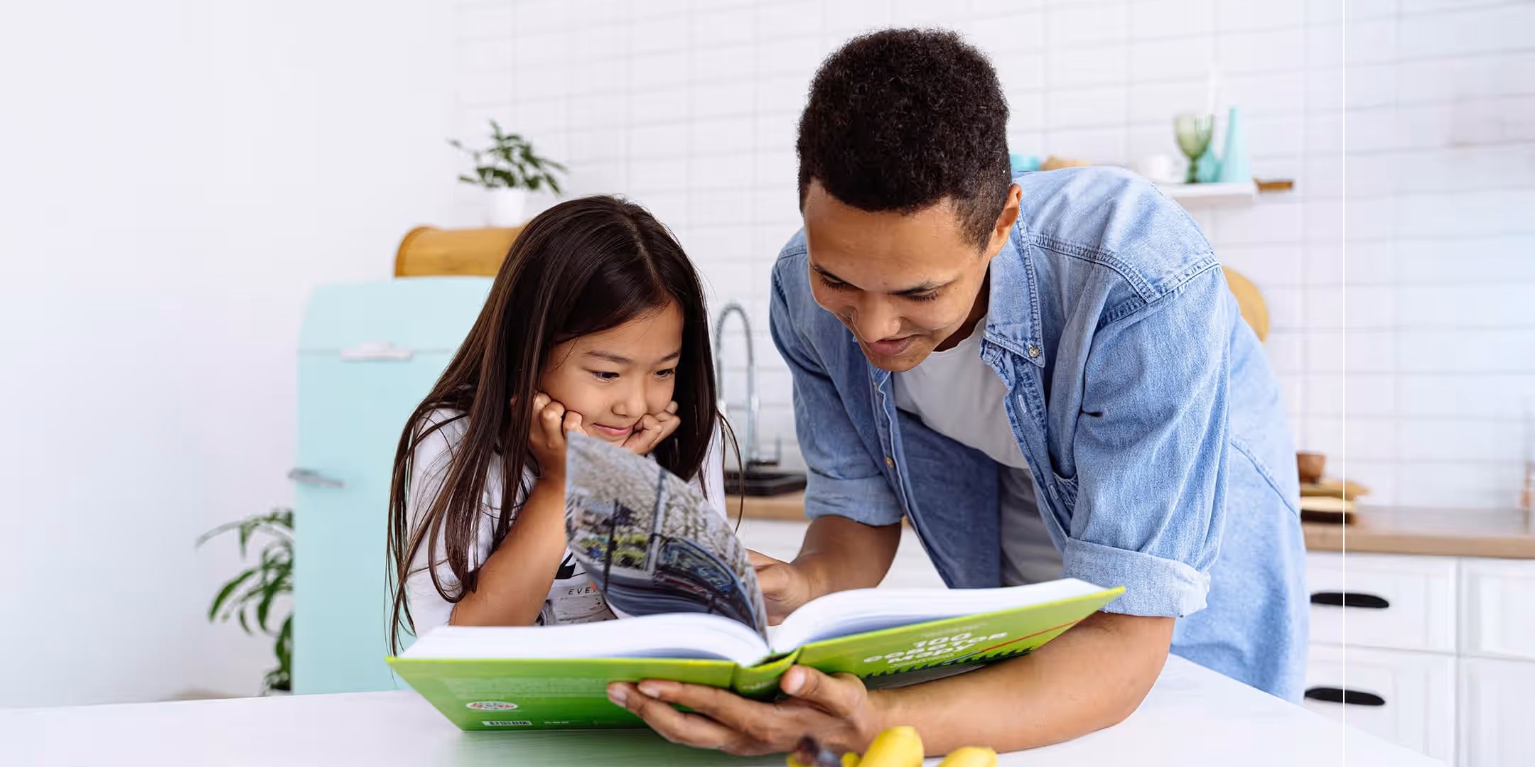 dad reading to daughter