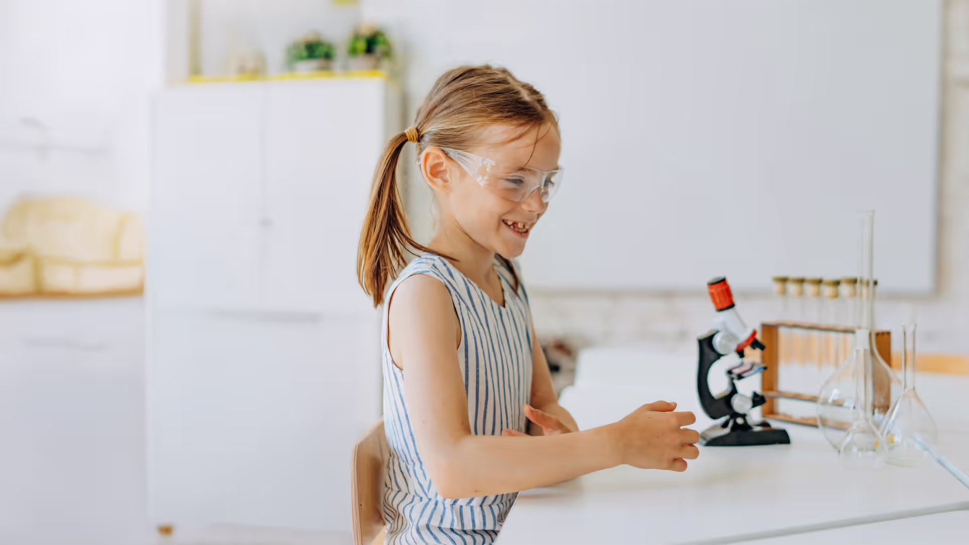 girl using a microscope